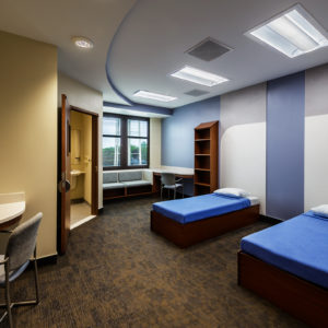 CDH inpatient behavioral health, semi-private room with anti-ligature furnishings and a calm finish palette